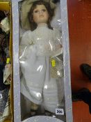 Bonneted doll with white silk dress and bag etc (boxed)