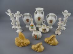 Three pottery DeeCee bunnies, three winged musician figurines and one other and a quantity of