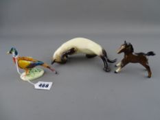 Two Beswick animal ornaments and a pottery pheasant
