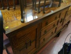 Oak railback sideboard with three centre drawers and two end cupboards