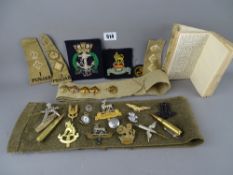 Military interest - a collection of various badges and insignia along with velour covered