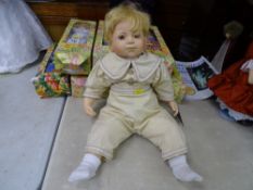 Little boy doll from The Knightsbridge Collection with cream outfit