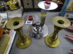 Art Deco chrome candlestick and a pair of Art Nouveau brass candlesticks