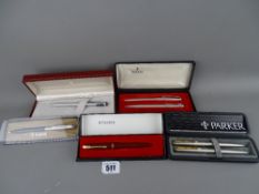 Collection of boxed Parker & Sheaffer pens including a burgundy Parker 51, a Sheaffer TRZ model