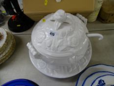 Large white pottery lidded tureen and ladle on stand containing a collection of book matches etc