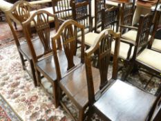 FOUR ANTIQUE OAK COUNTRY FARMHOUSE CHAIRS with pierced splatbacks, 94 cms high