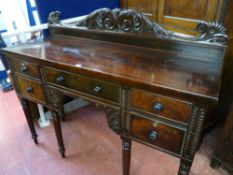 A REGENCY MAHOGANY RAILBACK SIDEBOARD with carved detail, 114 cms high overall, 136.5 cms wide, 47