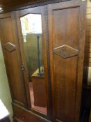 AN OAK SINGLE MIRROR WARDROBE with lower drawer, 190 cms high, 117 cms wide, 43 cms deep