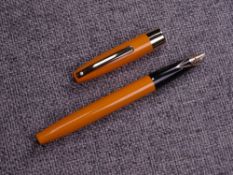 Vintage Mandarin Orange Sheaffer Imperial IV fountain pen with gold trim and 