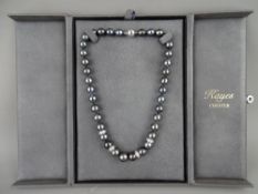 A TAHITIAN CULTURED PEARL & DIAMOND NECKLACE, the stones set in eighteen carat white gold roundel