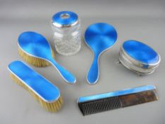 A GOOD SIX PIECE SILVER & BLUE ENAMEL DRESSING TABLE SET comprising two brushes, a dressing