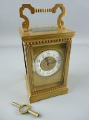 A FRENCH ARCHITECTURAL BRASS CASED CARRIAGE CLOCK with gong striking movement, Arabic set dial