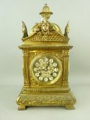 A GILT BRASS FRENCH MANTEL CLOCK with Japy Freres movement, 37.5 cms high, 20 cms wide