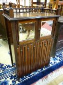 AN EDWARDIAN ROSEWOOD MUSIC CABINET with Stubleys patent label, no. 516, 106 cms high overall, 65