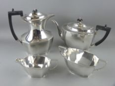 A FOUR PIECE SILVER TEA & COFFEE SERVICE, each piece of oblong plain panelled form, 42 ozs gross,