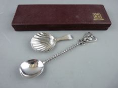 A SILVER CADDY SPOON with scallop shell bowl and bright cut tapered handle by George Burrows,
