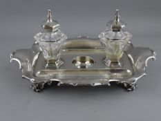 A VICTORIAN SILVER INKSTAND with hexagonal glass ink bottles, Barnard Brothers makers, London