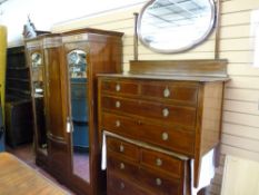 A GOOD INLAID MAHOGANY THREE PIECE BEDROOM SUITE of triple wardrobe with bowed centre panel, a chest