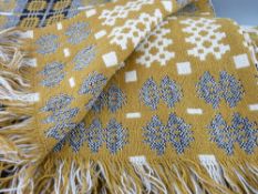 A VINTAGE WELSH WOOLLEN BLANKET in mustard and cream tones (imperfections)