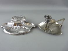 AN ART NOUVEAU WMF PLATED INKWELL and a similarly styled chamberstick (unmarked)