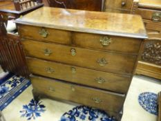 AN ANTIQUE OAK CHEST of two short over three long drawers on corner bracket feet, 93 cms high, 93