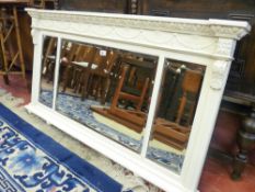 A PAINTED VINTAGE THREE SECTION OVERMANTEL MIRROR with egg and dart and swag decoration, 68 cms