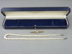A SINGLE STRAND 16 ins CULTURED PEARL NECKLACE and a fifteen carat gold seed pearl and blue stone