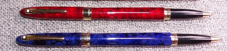 2 modern Flame Red and Ultramarine Blue Sheaffer Crest (reissue) roller ball pens in laque finish i