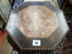 A CHINESE CARVED HARDWOOD MARBLE TOPPED STAND, 90 cms high