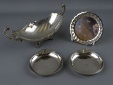 A SILVER TWIN HANDLED SHALLOW DISH and two circular ashtrays marked 925, with a small circular