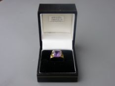 AN EIGHTEEN CARAT GOLD AMETHYST SET RING by Kathleen Mackinson, 5.3 grms gross, size 'L'