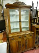 AN EDWARDIAN CARVED OAK TWO DOOR BOOKCASE CUPBOARD, 228 cms high, 120 cms wide, 44.5 cms deep