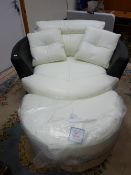 AN ULTRA MODERN BLACK & WHITE LEATHER EFFECT SWIVEL OVERSIZED ARMCHAIR & FOOTSTOOL, 130 cms wide,