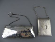 AN 18 cms LONG SILVER EVENING PURSE, Birmingham 1912 and a white metal combination necessaire with