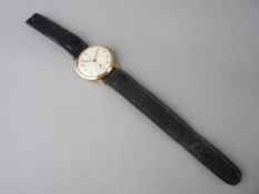 A GENT'S NINE CARAT GOLD TUDOR ROLEX WRISTWATCH on leather strap, the case back interior stamped '