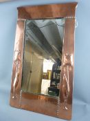 A LIBERTY OF LONDON ART NOUVEAU COPPER WALL MIRROR with stylized tulip decoration and Liberty