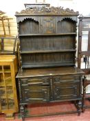A CIRCA 1940's JACOBEAN STYLE OAK DRESSER, 213 cms high, 122 cms wide, 47 cms deep