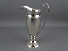 A SLENDER HELMET SHAPED SILVER CREAM JUG, Birmingham 1929, 2.7 troy ozs