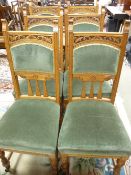 AN EXCELLENT SET OF SIX EDWARDIAN BLONDE OAK DINING CHAIRS, high backed with carved detail,