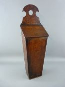 AN ANTIQUE OAK LIDDED CANDLEBOX, 50 cms high