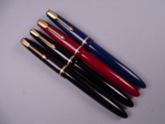 Four Vintage Parker Slimfold fountain pens (two black, one blue, one red), all with 14k nibs