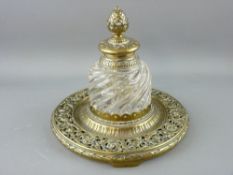 A LARGE CIRCULAR BRASS INK BOTTLE STAND, the lid having cone finial, early 19th Century, 17 cms