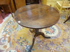 AN ANTIQUE OAK TILT TOP TRIPOD TABLE, 66 cms diameter top