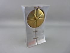 A DAVID MARSHALL STYLIZED CAST ALUMINIUM & BRONZE CLOCK, late 20th Century, 19.5 cms high, 11 cms