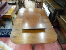 A REGENCY PERIOD STYLE MAHOGANY TWIN PEDESTAL DINING TABLE with additional leaf, 73 cms high, 106