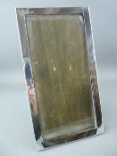 A PLAIN SILVER EASEL PICTURE FRAME to take a picture 22 x 10.5 cms, Birmingham 1923