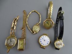 FOUR BELIEVED NINE CARAT GOLD ENCASED LADY'S WRISTWATCHES with yellow metal/gold straps, a nine