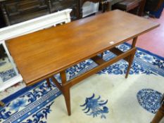 A KAI KRISTIANSEN TEAK ELEVATOR TABLE, 51 cms high, 140 cms wide, 60 cms deep (down position),