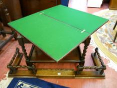 AN OAK BARLEY TWIST EXTENDING FIRE CURB and a foldover baize top two tier table, various