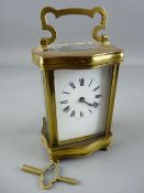 A FRENCH SERPENTINE BRASS CASED CARRIAGE CLOCK, the backplate marked 'Made in France', 15.5 cms high